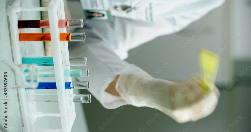 Pharmacology concept. Testing. Hands of a lab assistant with flask. Laboratory employee at work. Hands of chemist, medical laboratory assistant, scientist. Laboratory medical tests. Pharmacology concept. Testing. Hands of a lab assistant with flask. Laboratory employee at work. Hands of chemist, medical laboratory assistant, scientist. Laboratory medical tests.