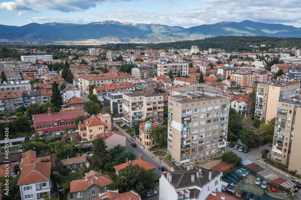 Drone view of residential building in Kazanlak town, Bulgaria, view with Balkan mountains on background