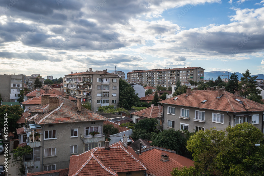 Residential building in Kazanlak town, Bulgaria, view with Balkan mountains on background Residential building in Kazanlak town, Bulgaria, view with Balkan mountains on background