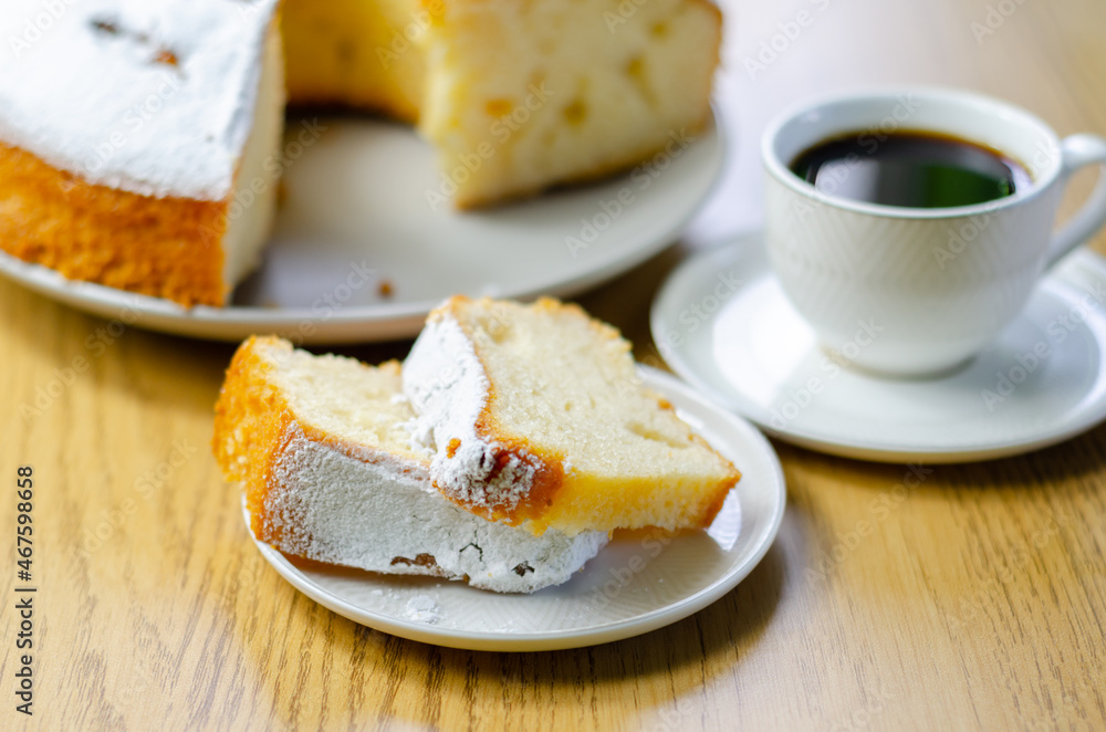 Portion of Madeira ring loaf cake served on a small plate Portion of Madeira ring loaf cake served on a small plate