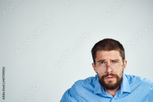 bearded man manager work emotions posing light background