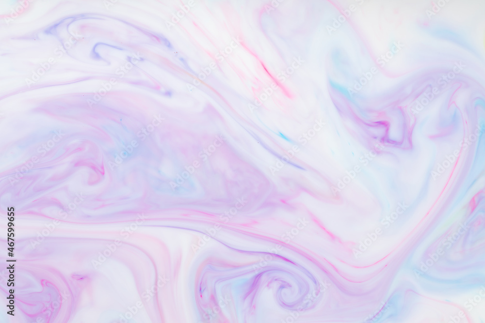 Fluid art multicolored background. Trendy pink backdrop with abstract stains on the liquid. Mixing paints on a liquid surface