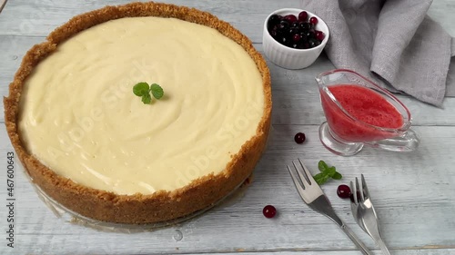 New York Cheesecake decorating with mint. Woman hands put mint on New York dessert. Close up