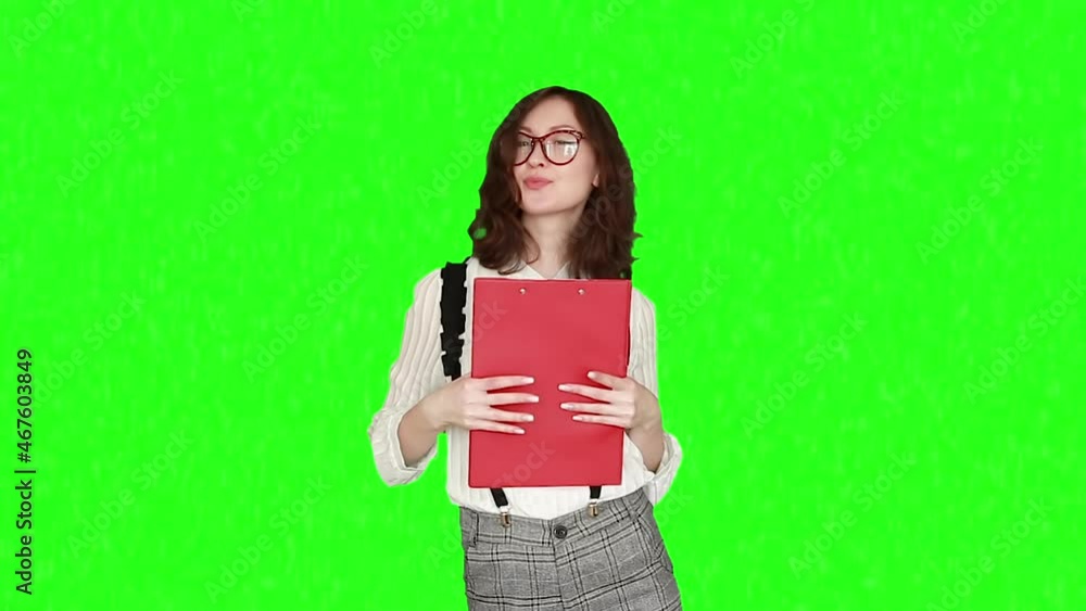 A young woman with a folder of documents in her hands isolated background chroma key A young woman with a folder of documents in her hands isolated background chroma key