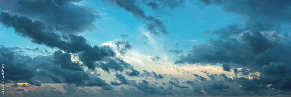 Formless dark clouds blown by the strong wind at evening. Scenic dramatic cloudscape at blue hour. Wide overcast panorama. The weather changes from clear to stormy. Windy weather. Formless dark clouds blown by the strong wind at evening. Scenic dramatic cloudscape at blue hour. Wide overcast panorama. The weather changes from clear to stormy. Windy weather.