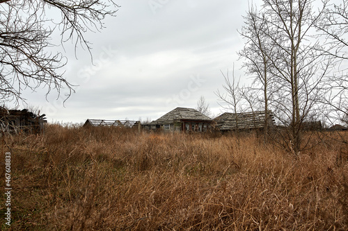 Old abandoned wooden houses in a Russian village.