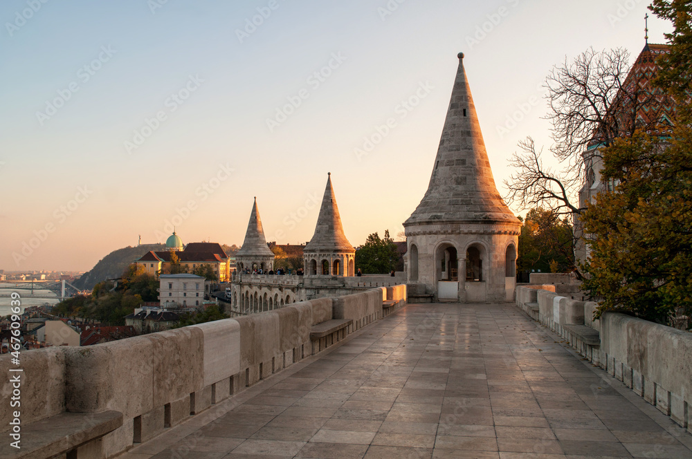 The tower of the Fisherman's Bastion in Budapest (Hungary) illuminated by the setting sun