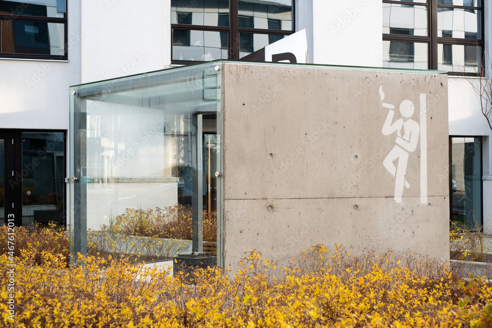Smoking corner outdoors between office buildings. Outdoor designated