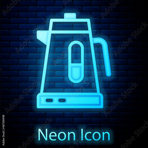 Glowing neon Electric kettle icon isolated on brick wall background. Teapot icon. Vector