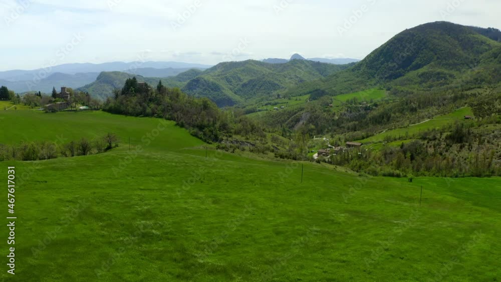 Aerial Beautiful View Of Built Houses On Landscape, Drone Ascending Over Green Landscape - Apennine Mountains, Italy Aerial Beautiful View Of Built Houses On Landscape, Drone Ascending Over Green Landscape - Apennine Mountains, Italy