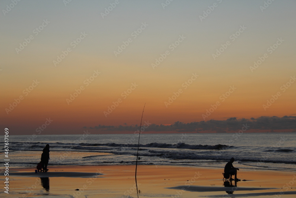 Fishing in the Ocean During Sunrise