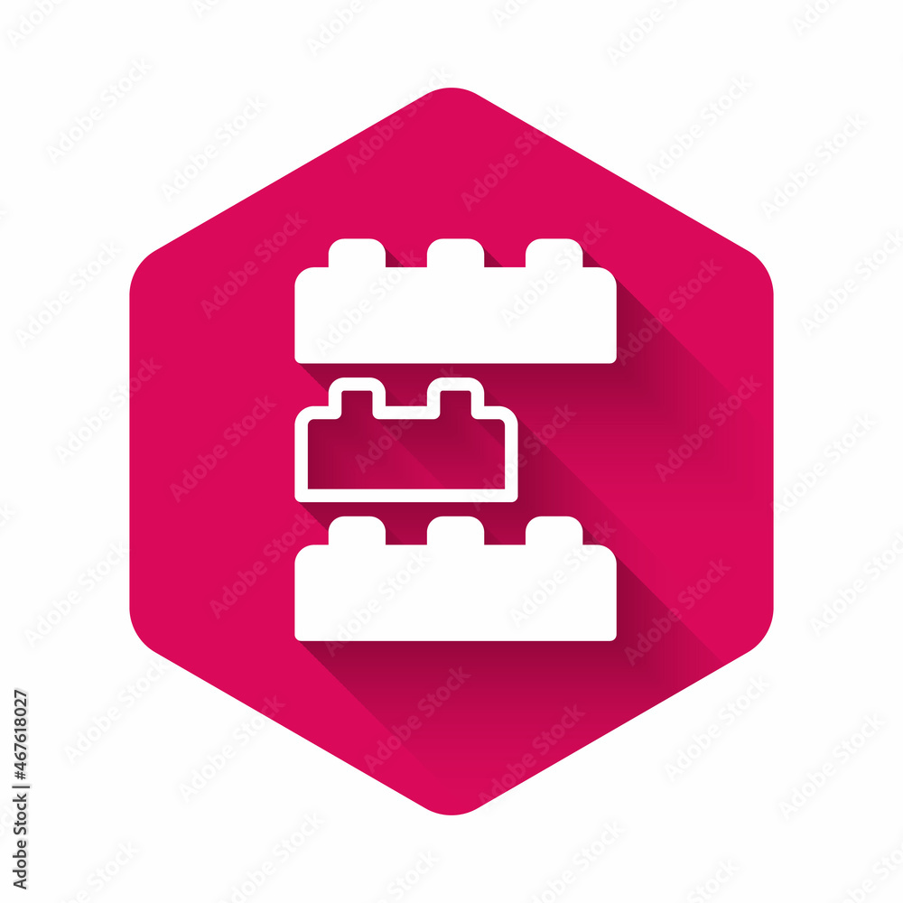 White Toy building block bricks for children icon isolated with long shadow background. Pink hexagon button. Vector White Toy building block bricks for children icon isolated with long shadow background. Pink hexagon button. Vector