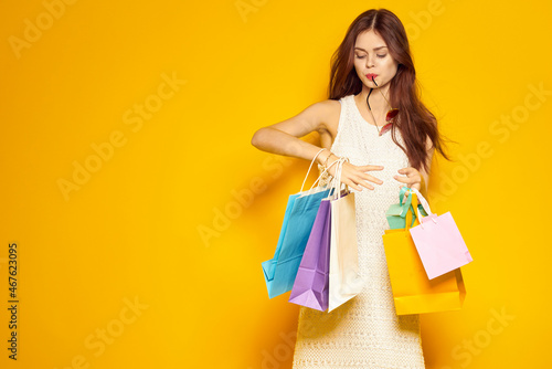 smiling woman wearing sunglasses posing shopping fashion studio model
