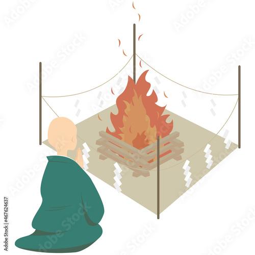 お焚き上げをする僧侶