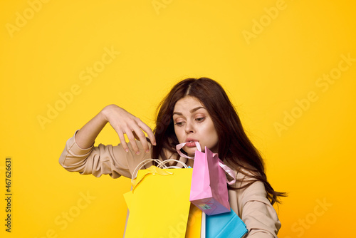 smiling woman with packages in hands Shopaholic isolated background