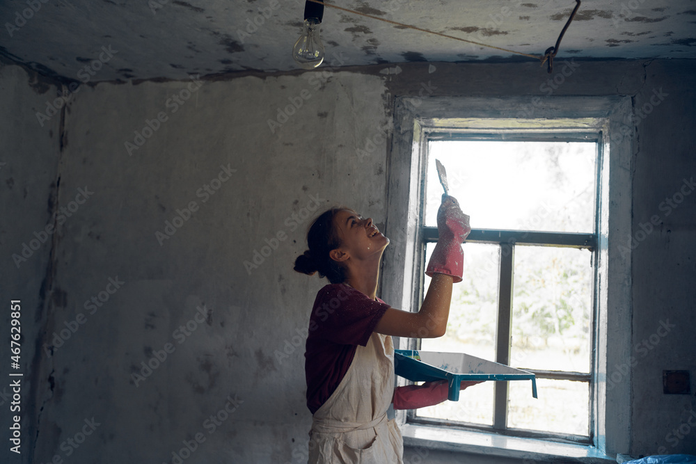 woman paints house decoration interior renovation painter woman paints house decoration interior renovation painter