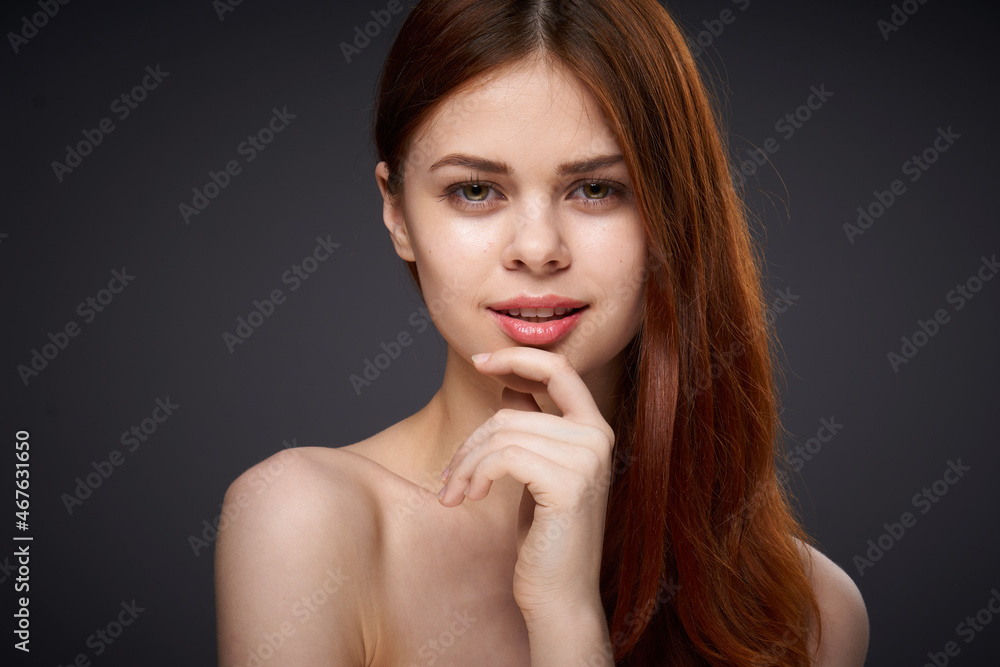 woman with bare shoulders and beautiful hairstyle close-up attractive look woman with bare shoulders and beautiful hairstyle close-up attractive look