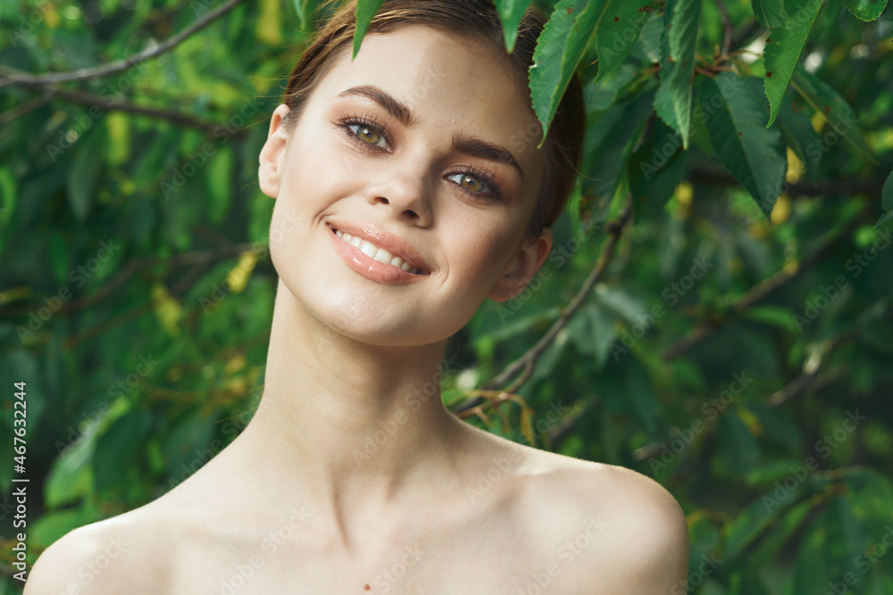 portrait of a woman green leaves clean skin nature summer cropped view portrait of a woman green leaves clean skin nature summer cropped view