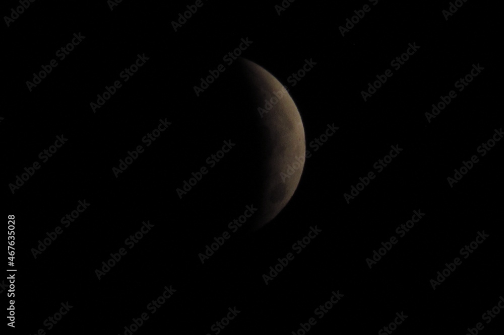 Lunar eclipse, at night, white quarter moon. Lunar eclipse, at night, white quarter moon.