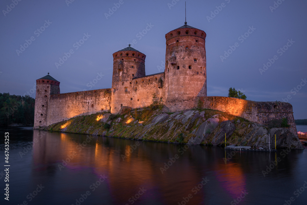 The ancient fortress of Olavinlinna close-up in July twilight. Savonlina, Finland