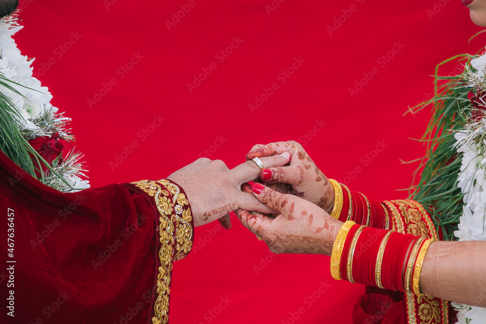 Indian couple's ring exchange hands close up