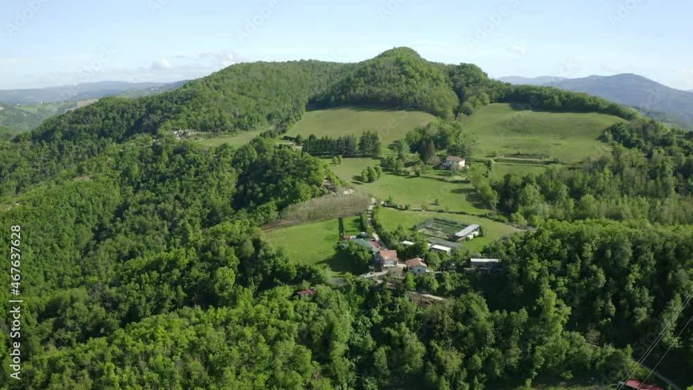 Aerial Beautiful View Of Houses On Green Hill, Drone Flying Over Trees In Sunlight - Apennine Mountains, Italy Aerial Beautiful View Of Houses On Green Hill, Drone Flying Over Trees In Sunlight - Apennine Mountains, Italy