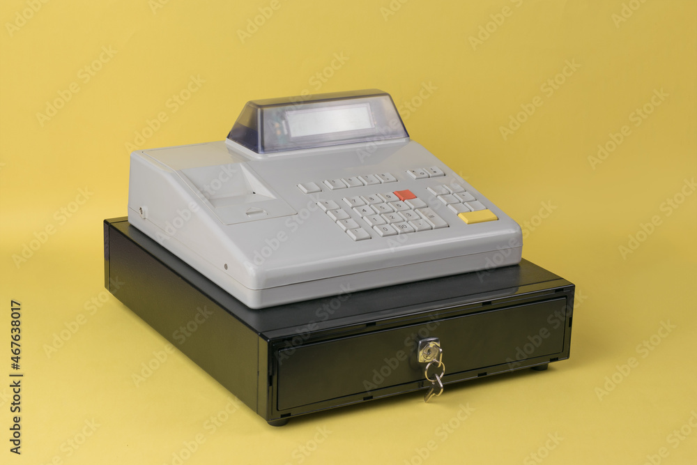 Classic cash register for cash on a yellow background. Classic cash register for cash on a yellow background.