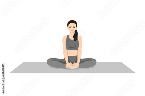 Bound Angle Pose, Butterfly Pose, Beautiful girl practice Baddha Konasana. Young attractive woman practicing yoga exercise. working out, black wearing sportswear, grey pants and top, indoor full 