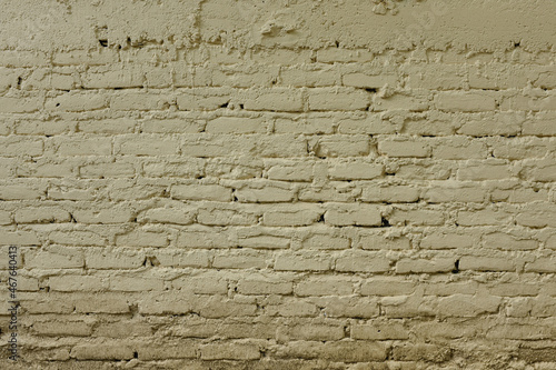 Light cream brick wall texture. Vintage tone rough decaying structure wallpaper