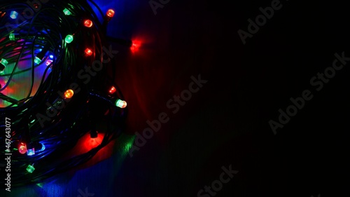 Christmas lights. Beautiful colorful abstract background with Christmas tree decorations. Concept for winter and holidays.