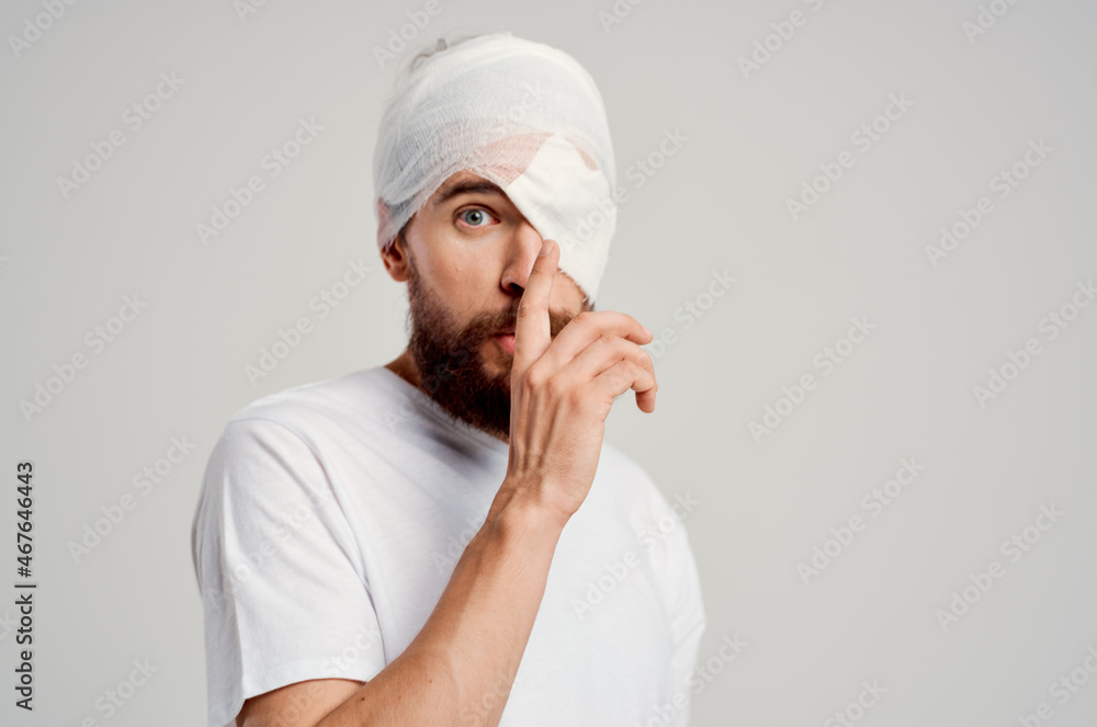 sick man with bandaged head and eye hospitalization hospital medicine sick man with bandaged head and eye hospitalization hospital medicine