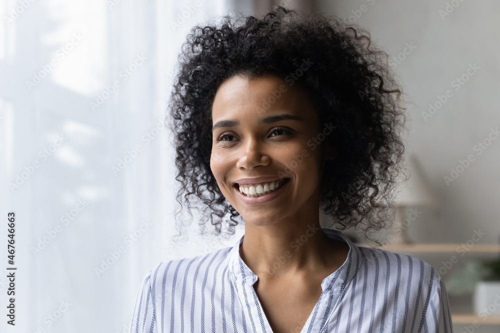 Head shot close up of happy dreamy African American woman looking in ...