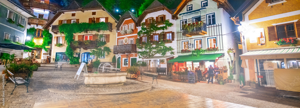 Hallstatt, Austria. City central square with colorful homes at summer night.