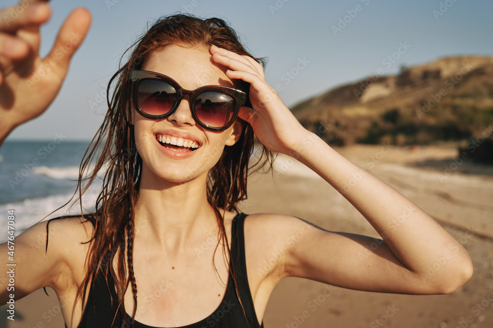 cheerful woman sunglasses posing black swimsuit island cheerful woman sunglasses posing black swimsuit island
