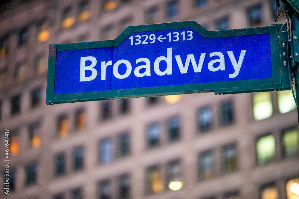 Broadway street sign at night in New York City - Manhattan.