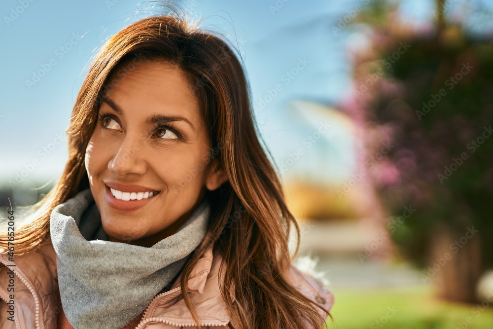 Young hispanic woman smiling happy standing at the city. Young hispanic woman smiling happy standing at the city.