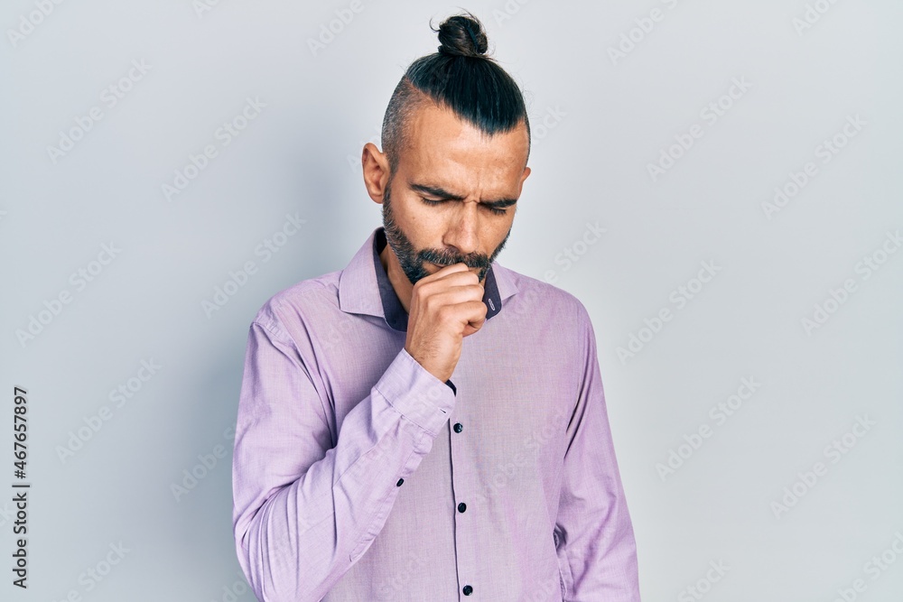 Young hispanic man wearing casual clothes feeling unwell and coughing as symptom for cold or bronchitis. health care concept. Young hispanic man wearing casual clothes feeling unwell and coughing as symptom for cold or bronchitis. health care concept.