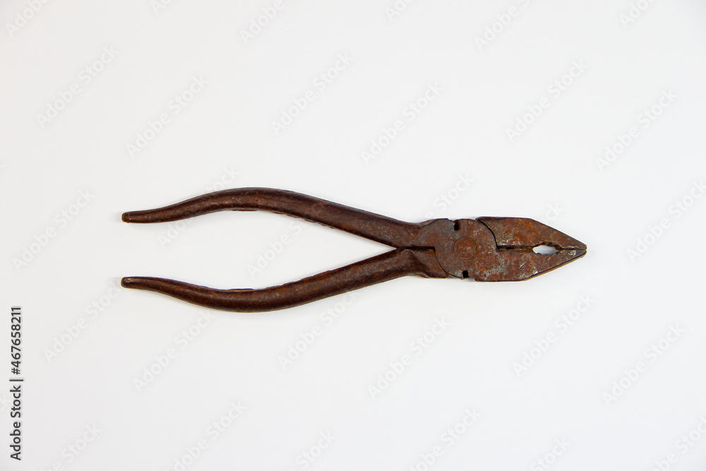 Rusty pliers on the white background Rusty pliers on the white background