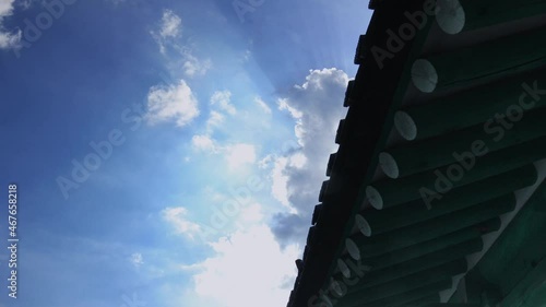 Clouds flowing over the eaves of traditional Korean hanok architecture