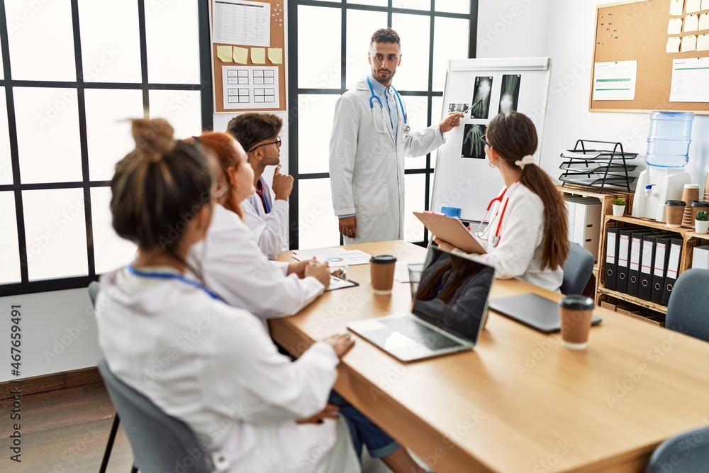 Obraz premium Group of young doctor discussing in a medical meeting at the clinic office.