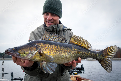 Angler presenting huge lake zander
