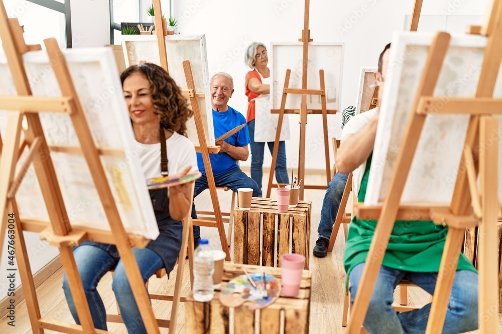 Group of middle age draw students smiling happy drawing at art studio. Group of middle age draw students smiling happy drawing at art studio.