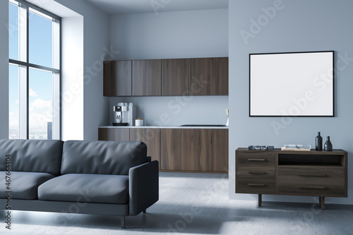 Dining interior with sofa and kitchen set near window, drawer and mock up poster © ImageFlow