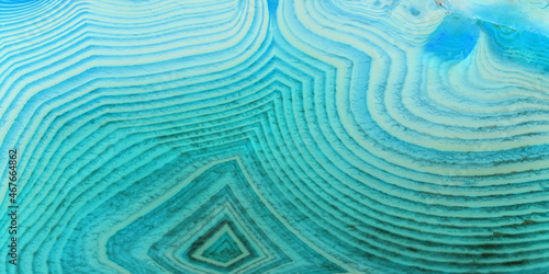 geametric lines of light and dark cyan agate texture