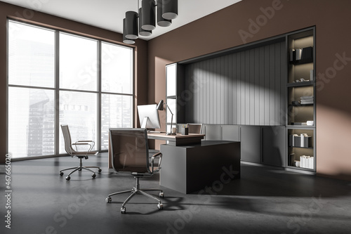 Modern grey and brown executive office. Corner view.