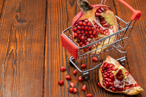 Ripe and juicy pomegranate in a shopping trolley