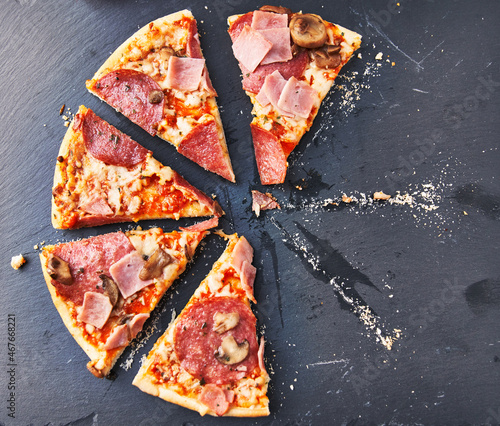  Slices of italian pizza on blackboard surface
