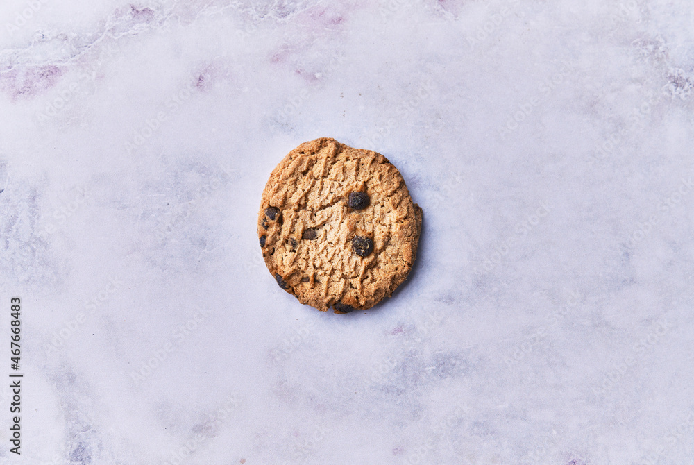 Delicious chocolate cookie on a marble table Delicious chocolate cookie on a marble table