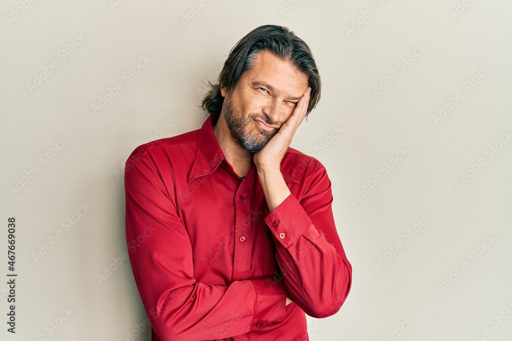 Middle age handsome man wearing casual clothes thinking looking tired and bored with depression problems with crossed arms. Middle age handsome man wearing casual clothes thinking looking tired and bored with depression problems with crossed arms.