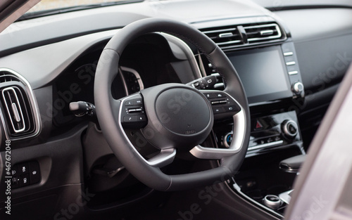 The interior of a new car. Steering wheel, tablet, automatic transmission, instrument panel © yarm_sasha